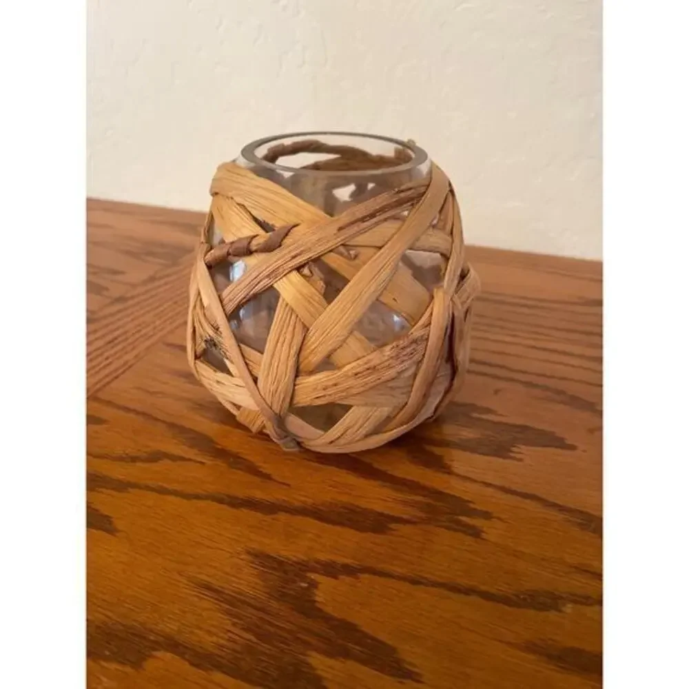 Straw covered glass vase